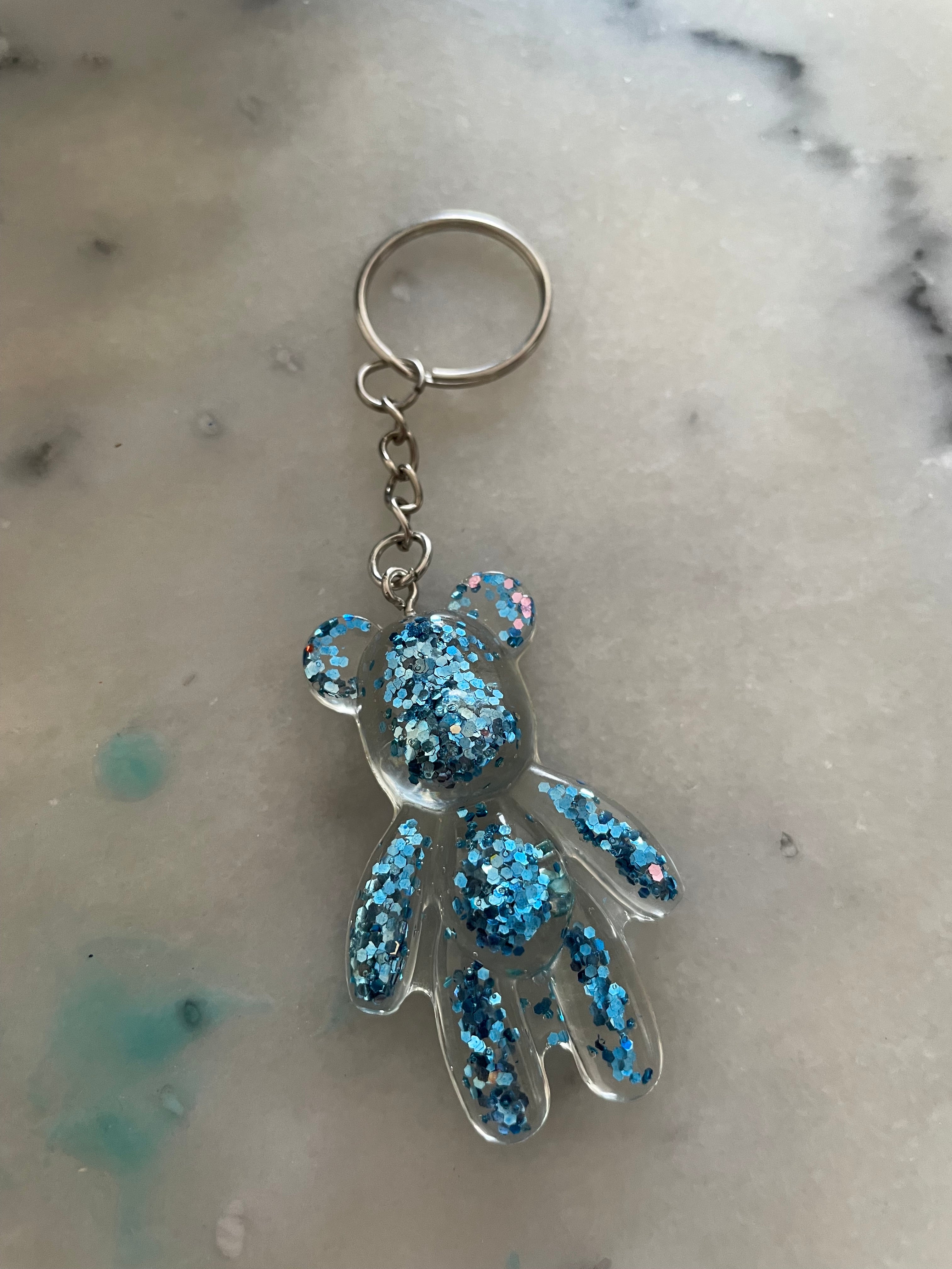 Porte clé fin ours bleu pailletté